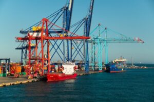 Container vessels and port cranes at a commercial seaport