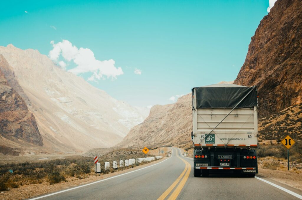 Freight truck driving along a mountain highway