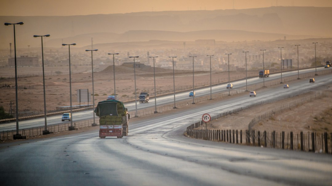 Freight truck travelling along a highway, illustrative of Saudi and GCC transport